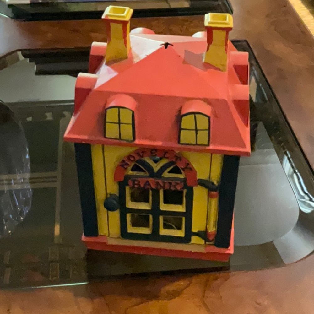 Vintage Reproduction Bank. Banker is inside front door. Mint condition, awesome.